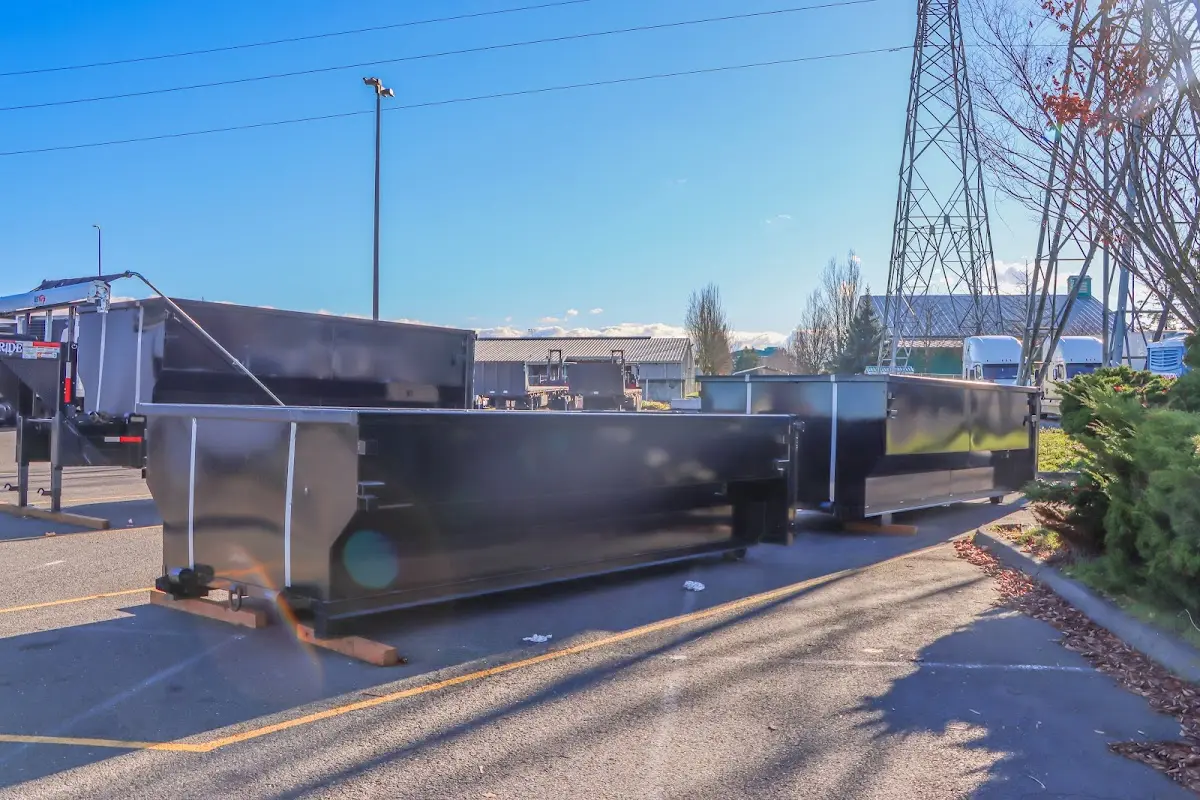 Roll-off dumpster ready for waste disposal at job site for Construction Dumpster Rental in EspaÃ±ola